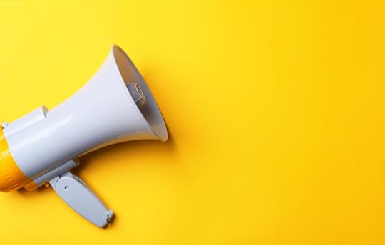 megaphone on yellow background