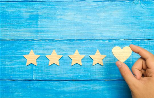 Blue background four stars, one heart with a hand