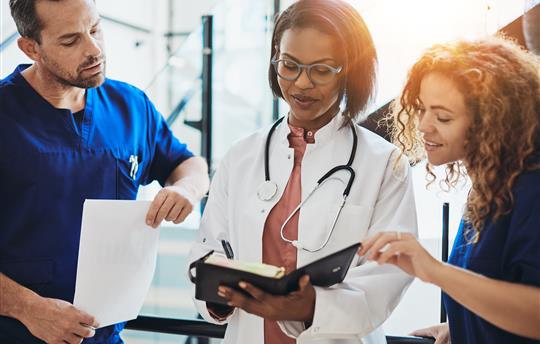 doctors looking at a chart together