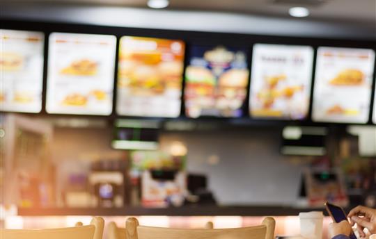 blurry image of a fast food restaurant counter