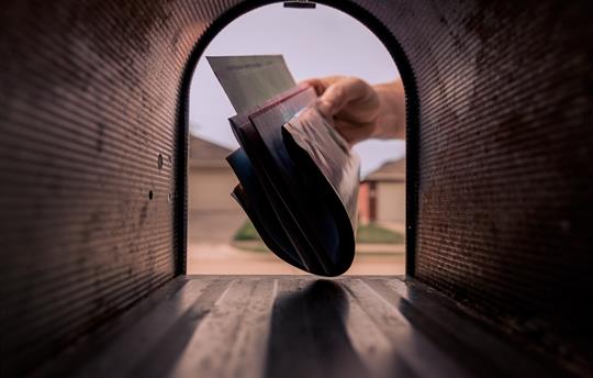 mail being taken from mailbox