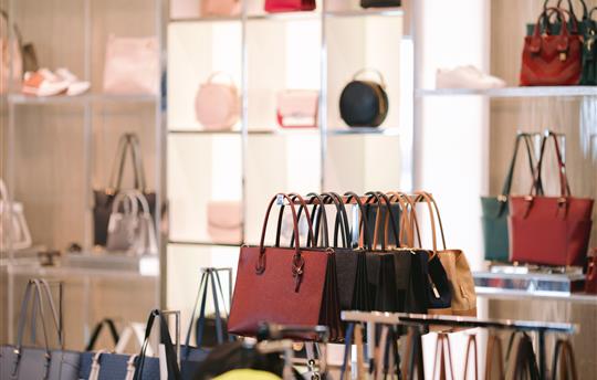 leather handbags in a luxury fashion store