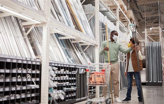 father and son wearing masks and shopping at a home improvement store