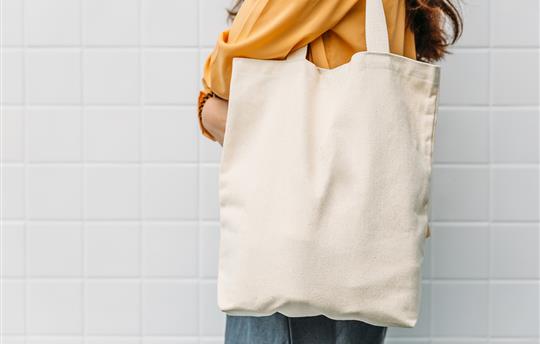Woman holding canvas bag