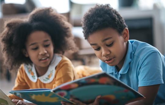 children reading a book