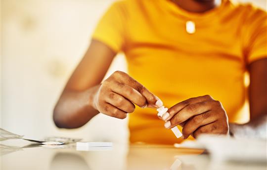 woman opening diagnostic test kit
