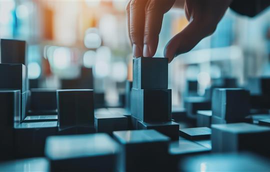 hand touching building blocks