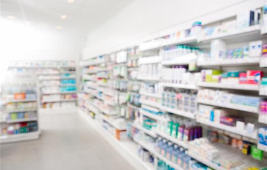selection of goods at a pharmacy blurred
