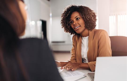 Woman listening intently to her customer
