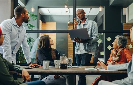 Diverse business team having a meeting in a creative workplace
