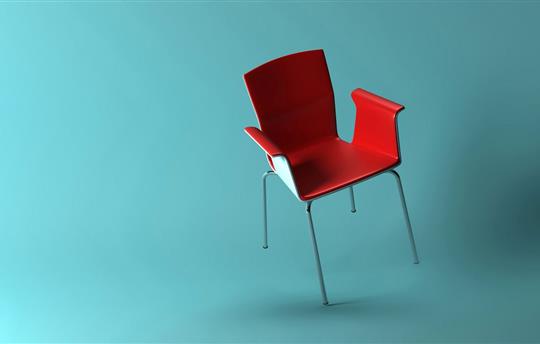 3D rendering of red armchair balancing on one leg with a turquoise backdrop