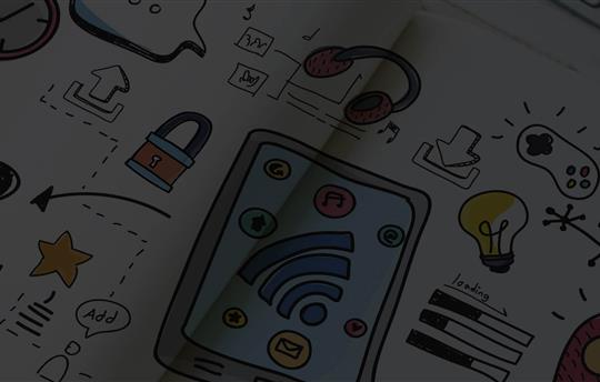 paper with colorful drawings of a clock, tablet, lock, light bulb, video game controller, arrows and star
