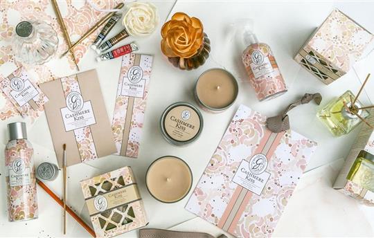 Assortment of floral-printed packaging for candles, oils and lotions