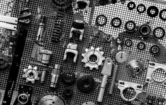 black and white picture of assorted car parts