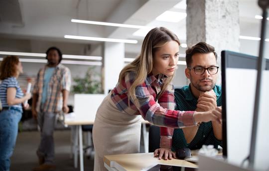 Group of business people and creative designers working as a team in office