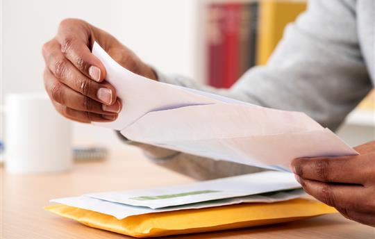 man hands opening mail