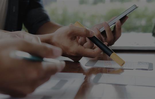 ux designer pointing to wireframe sketches with a marker